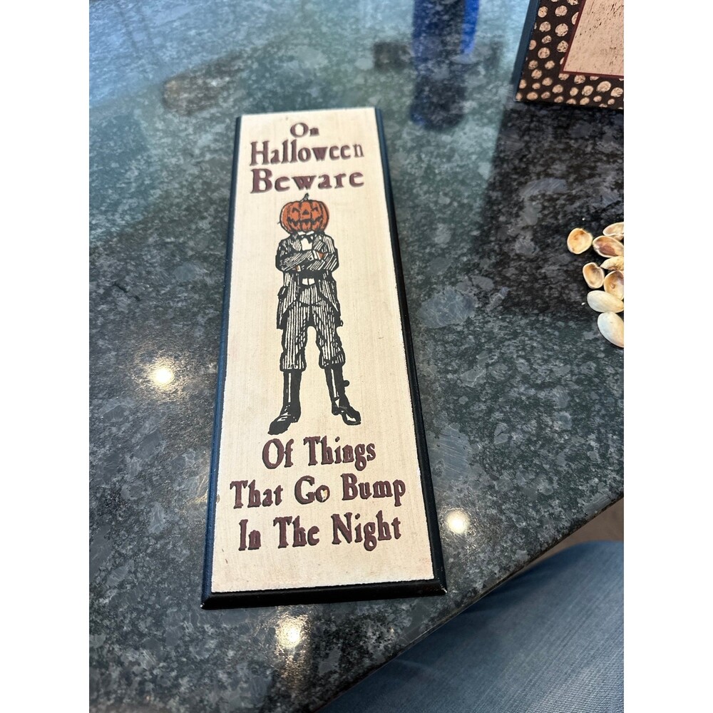 Halloween jack-o’-lantern sign with hook in the back